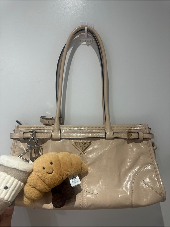 Prada Handbags - Prada Beige Patent Leather Shoulder Bag with Charm